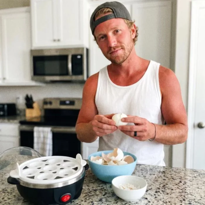 Peeling an egg in the kitchen
